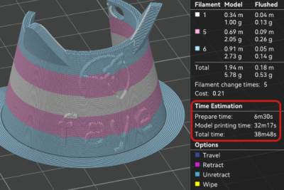 Ein Screenshot einer Druckvorschau von einem Mate Tag in Trans Farben in OrcaSlicer. Die Druckzeit beträgt 38 Minuten und 48 Sekunden. Es sind 5 Filamentwechsel notwendig.